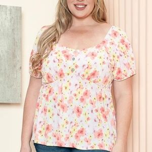 Gilli Flutter Sleeve flower print Smocked Blouse with pink and yellow tones.